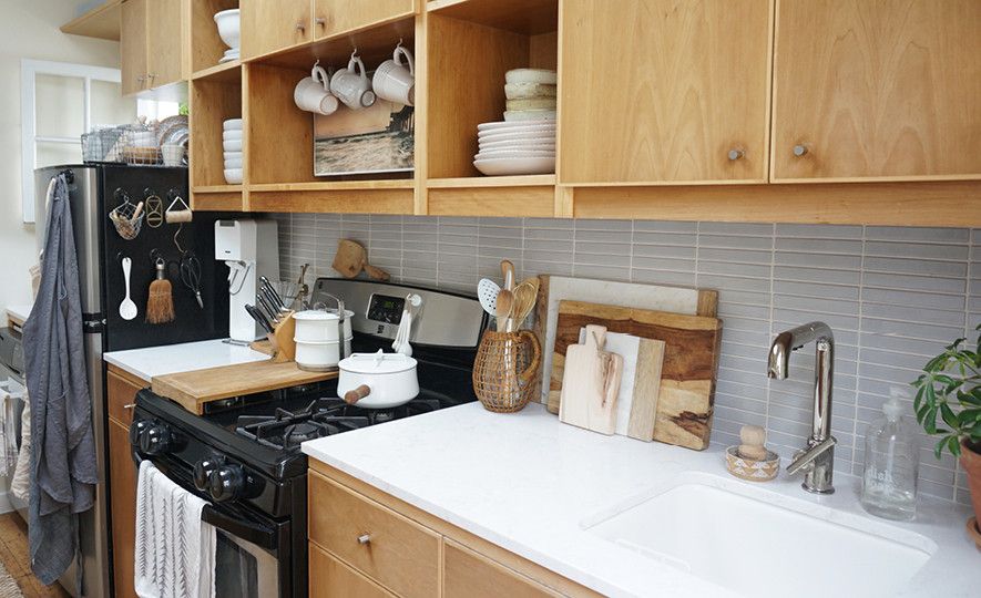 the Tiny Cannal Cottage by Leigh Morris which features light wood countertops with Cambria Quartz Torquay countertops.