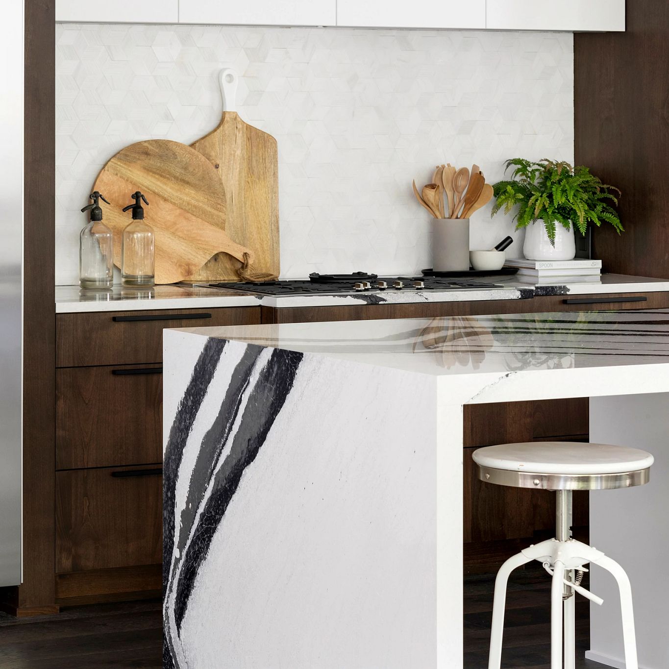 A kitchen with stools and a counter top
Description automatically generated with low confidence
