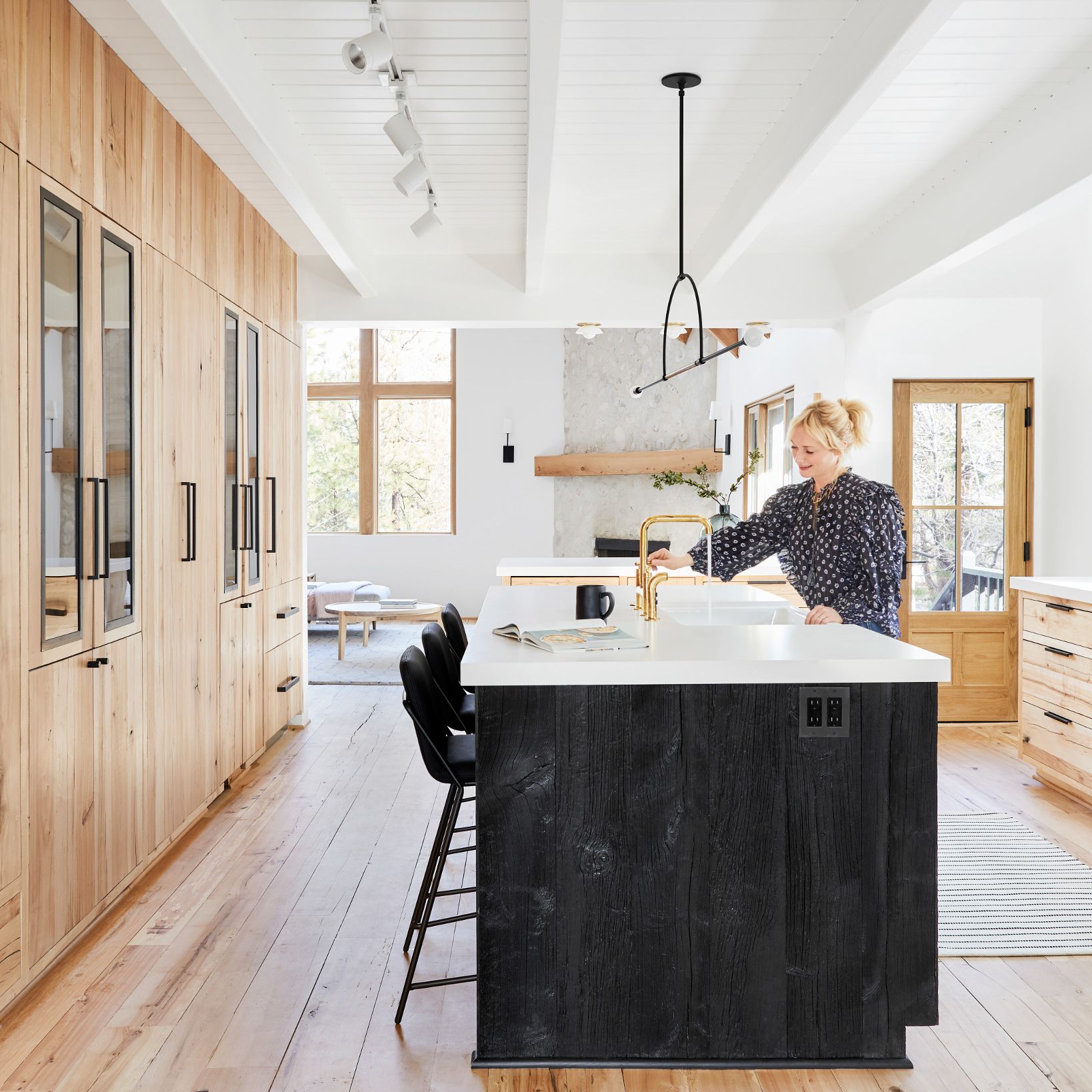 A kitchen with a wood floor
Description automatically generated