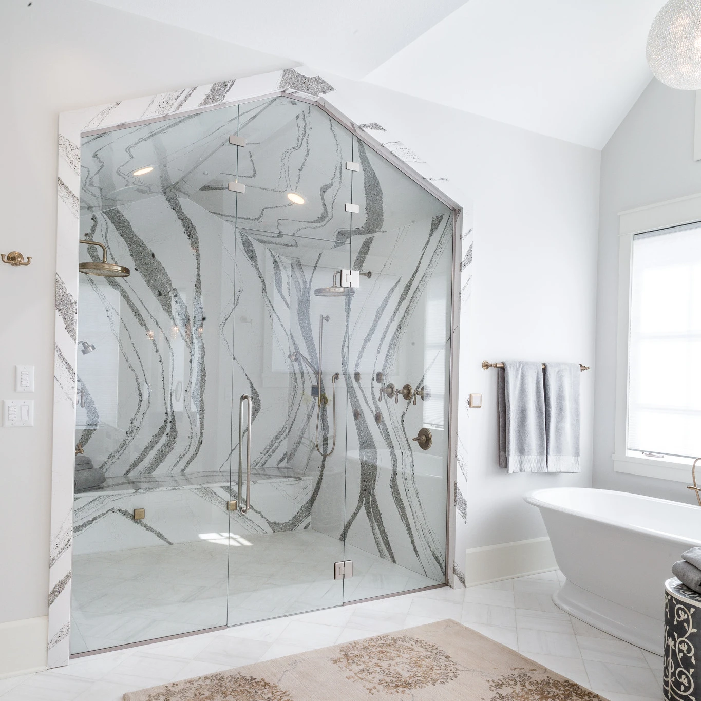 Large and bright bathroom with an Annica quartz shower clad
