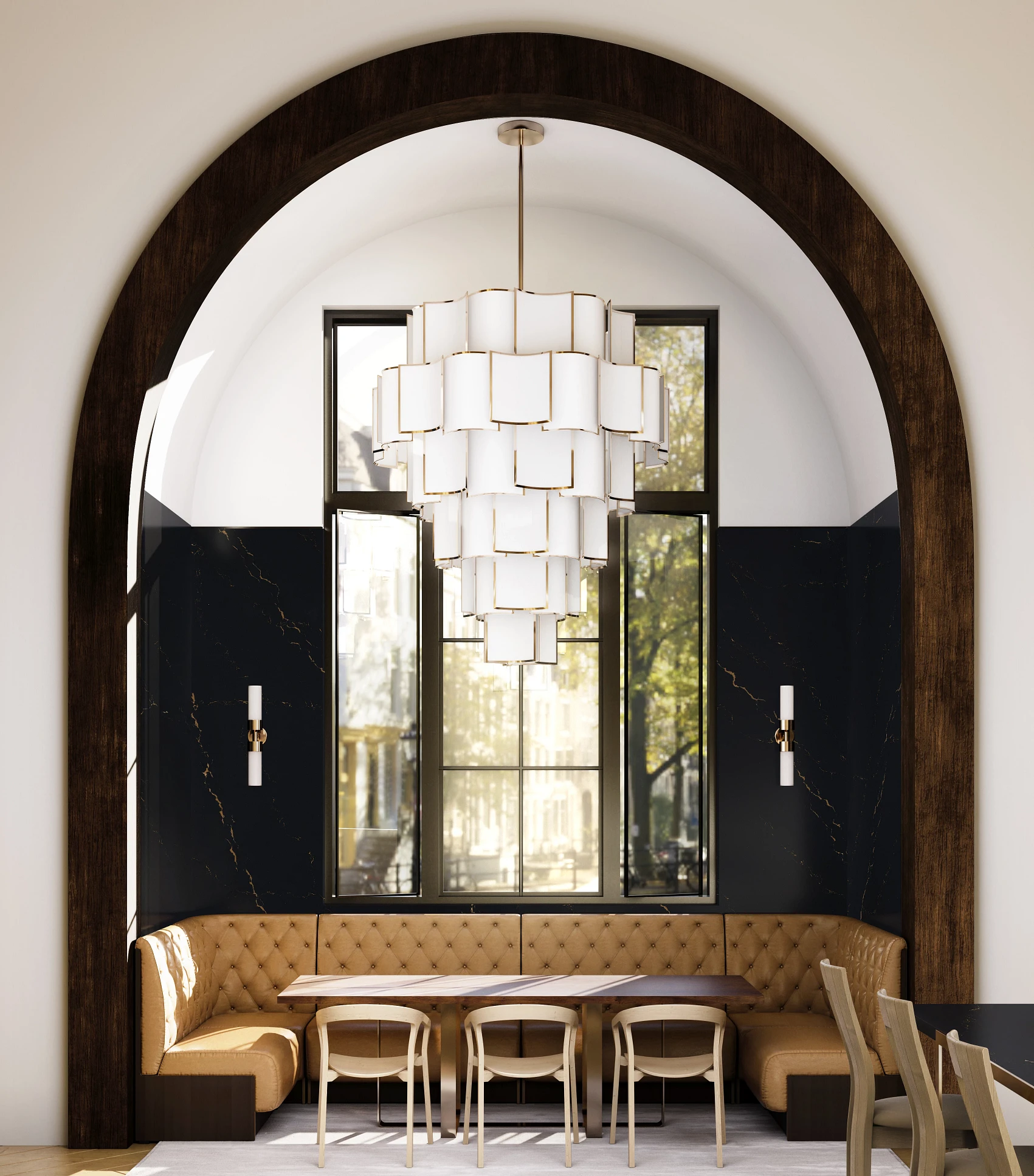 a breakfast nook hidden behind a grand archway with a luxurious hanging chandelier and wall made from Cambria Quartz Woodcroft.