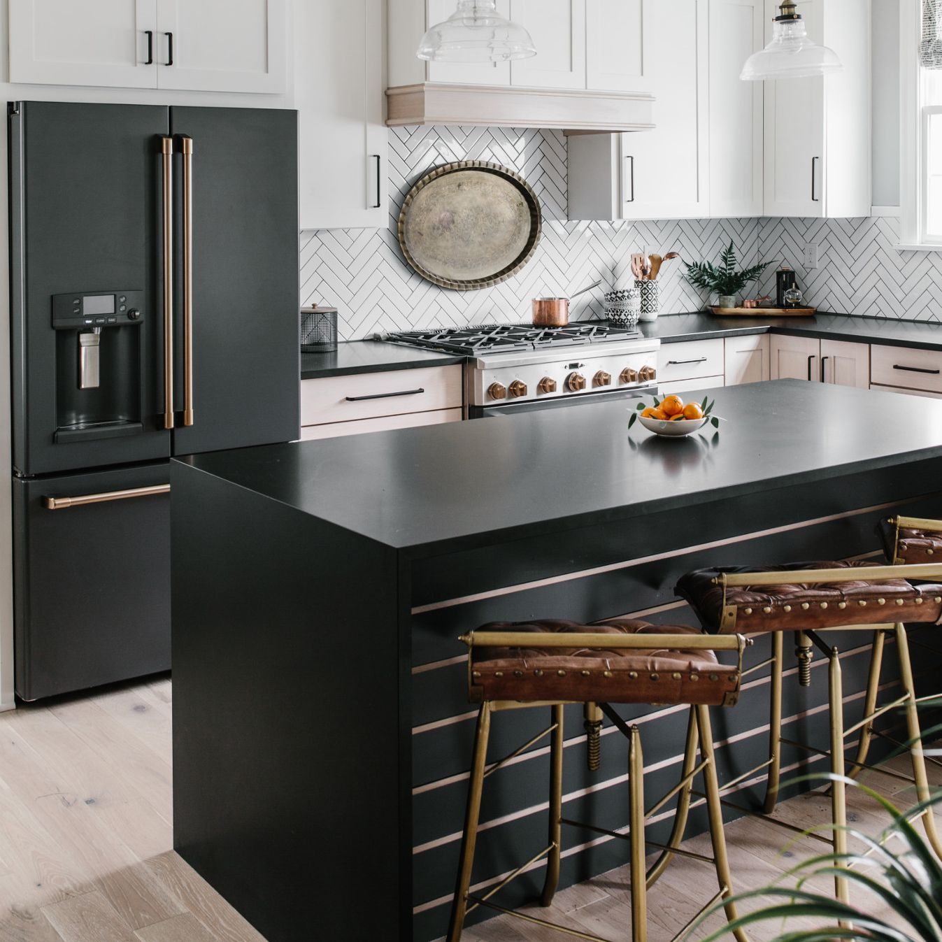 A kitchen with a large window
Description automatically generated