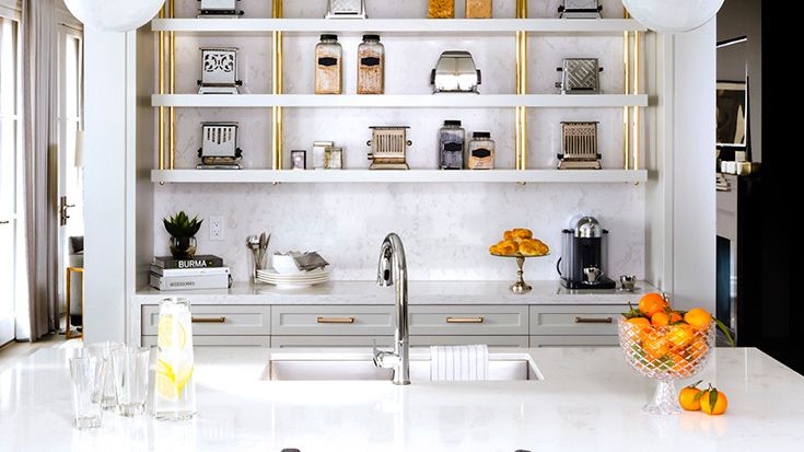 a Torquay quartz countertop island and backsplash in a bright white kitchen